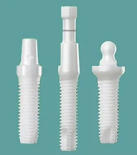 Photo of three non-metal dental implant fixtures, for information on zirconia implants from Atlanta Oral Surgery Associates & Dental Implant Centers.